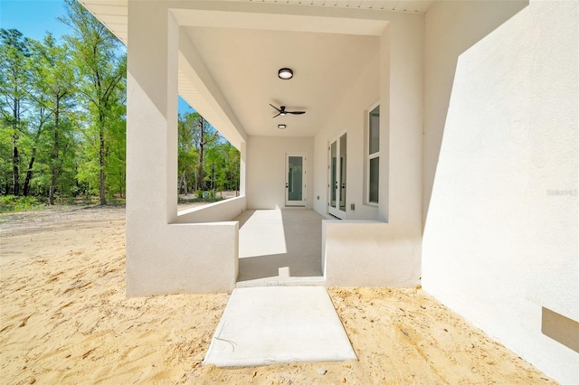 6877 SW 131st Cir, Ocala, FL 34481 - view of patio featuring a ceiling fan and french doors