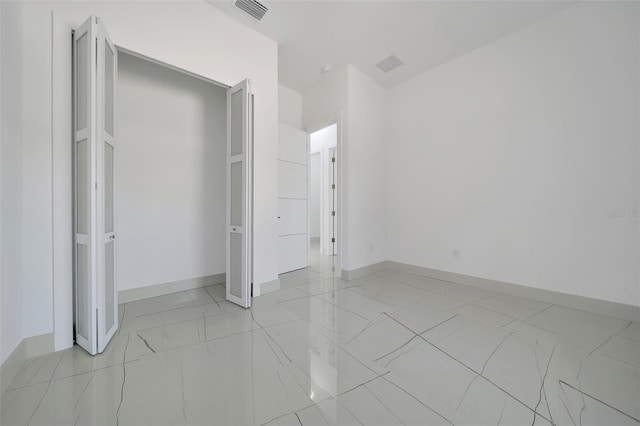 6877 SW 131st Cir, Ocala, FL 34481 - unfurnished bedroom featuring light marble finish floors and baseboards