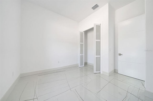 6877 SW 131st Cir, Ocala, FL 34481 - unfurnished bedroom featuring baseboards and light marble finish flooring