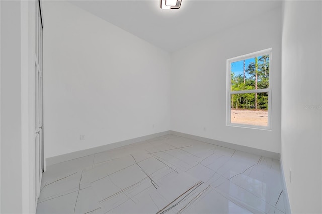 6877 SW 131st Cir, Ocala, FL 34481 - spare room with baseboards and light marble finish floors