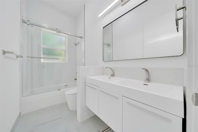 6877 SW 131st Cir, Ocala, FL 34481 - bathroom with toilet, combined bath / shower with glass door, and double vanity