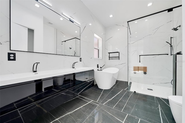 6877 SW 131st Cir, Ocala, FL 34481 - bathroom with marble tiled floors, a marble finish shower, double vanity, a freestanding tub, and toilet