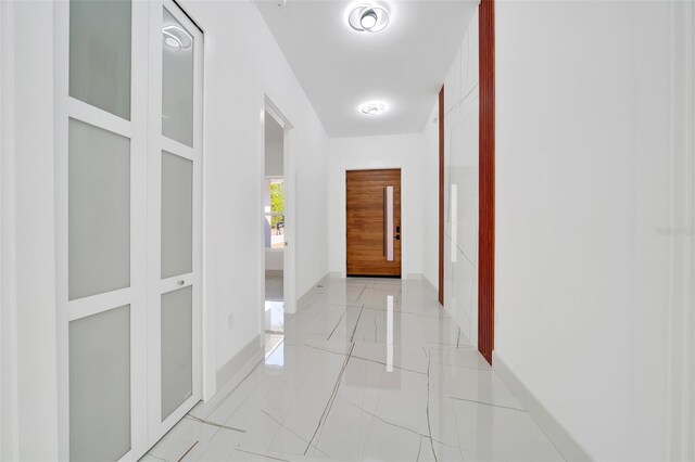 6877 SW 131st Cir, Ocala, FL 34481 - hallway featuring baseboards and elevator