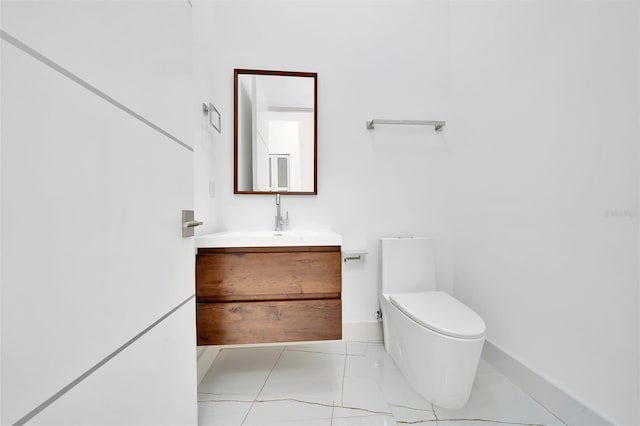 6877 SW 131st Cir, Ocala, FL 34481 - bathroom with toilet, vanity, and baseboards