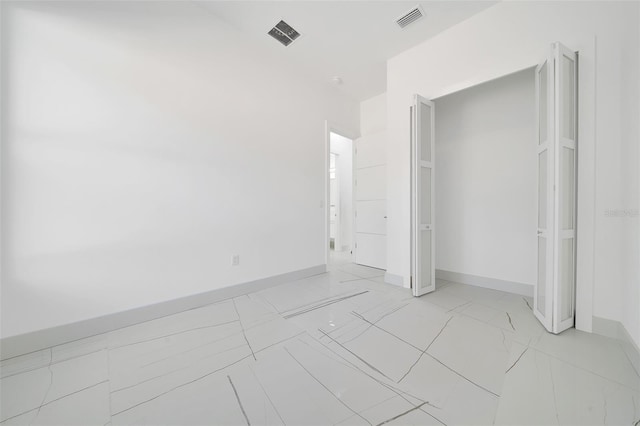 6877 SW 131st Cir, Ocala, FL 34481 - unfurnished bedroom featuring light marble finish flooring and baseboards