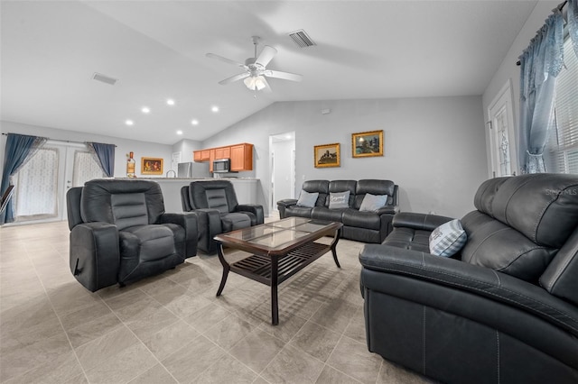 living room featuring french doors, ceiling fan, and lofted ceiling