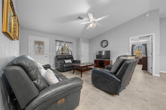 tiled living room with lofted ceiling and ceiling fan