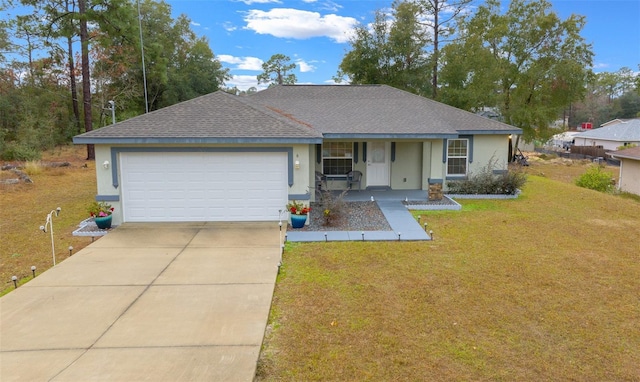 ranch-style home featuring a garage and a front yard