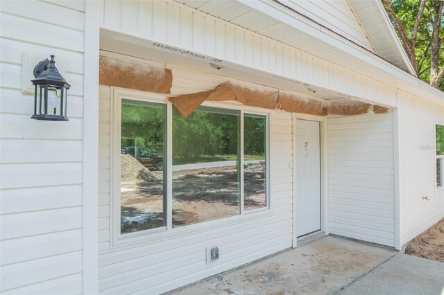 doorway to property with a patio area