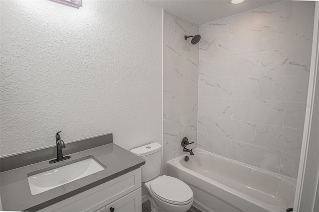 full bathroom with toilet, a textured ceiling, tiled shower / bath, and vanity