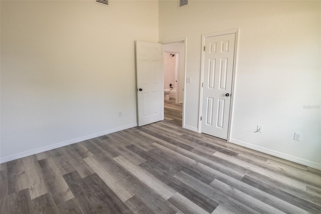 spare room featuring wood-type flooring