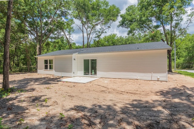 rear view of house featuring a patio