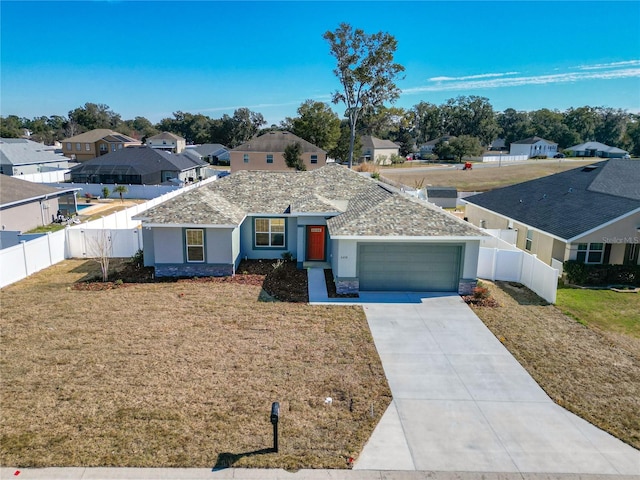 ranch-style home with a garage and a front yard