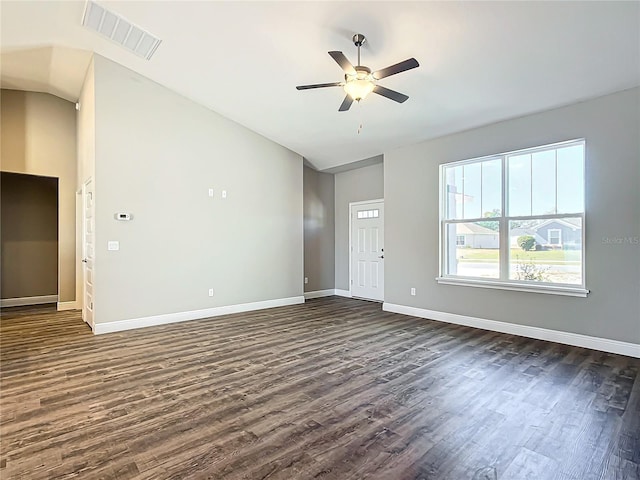 unfurnished living room with ceiling fan, dark hardwood / wood-style floors, and vaulted ceiling