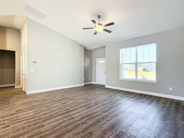 spare room with ceiling fan, dark hardwood / wood-style floors, and vaulted ceiling