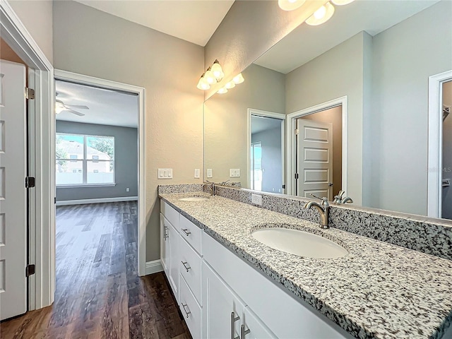 bathroom with vanity and hardwood / wood-style floors