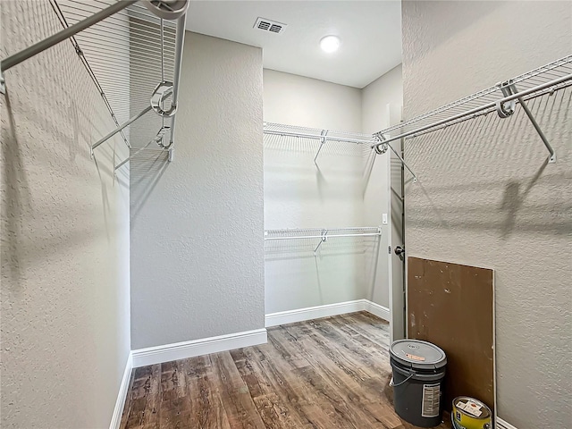 spacious closet featuring hardwood / wood-style flooring