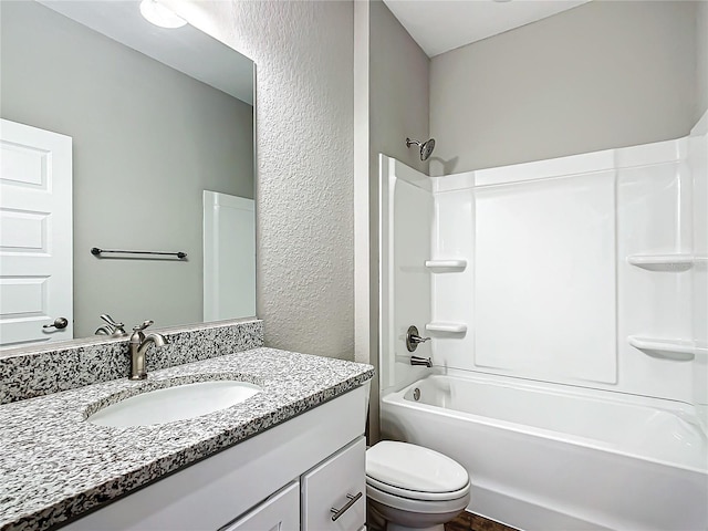 full bathroom with vanity, shower / bathtub combination, and toilet