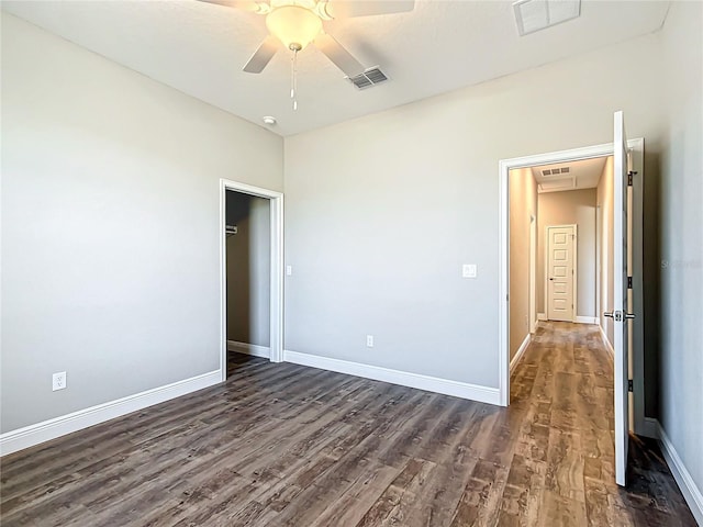 unfurnished bedroom with dark hardwood / wood-style floors and ceiling fan