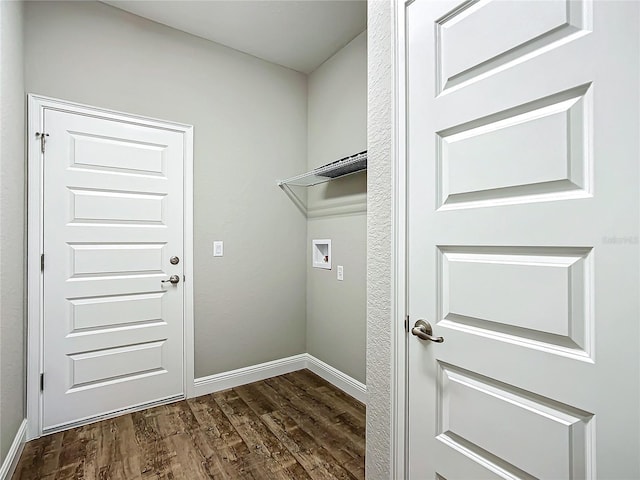 laundry room featuring dark wood-type flooring and washer hookup