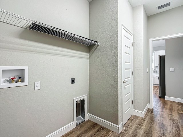 laundry room with hookup for a washing machine, dark wood-type flooring, and hookup for an electric dryer