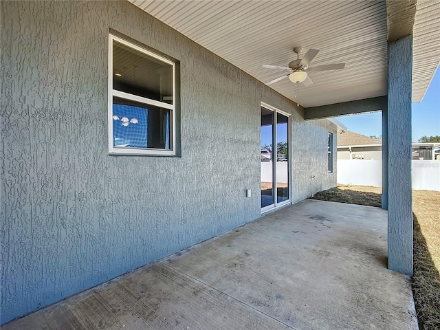 view of patio featuring ceiling fan