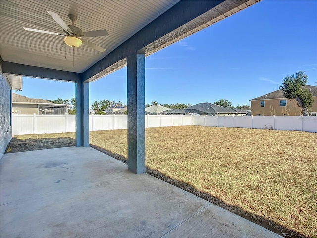 view of yard featuring ceiling fan and a patio area