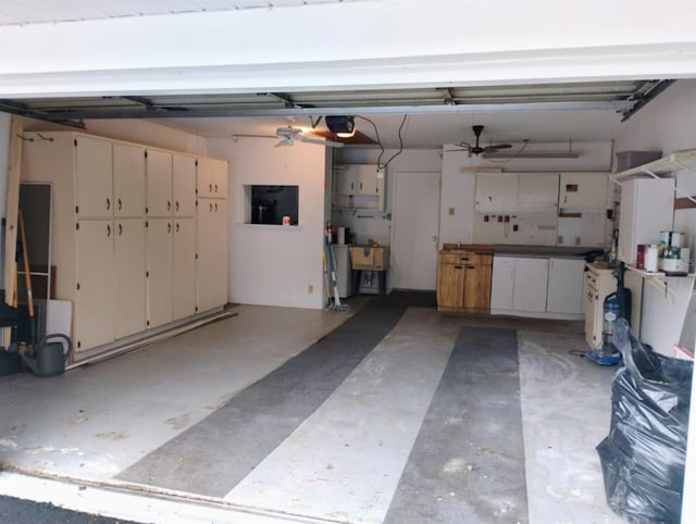 garage with a garage door opener and sink