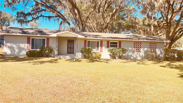 ranch-style home with a front yard