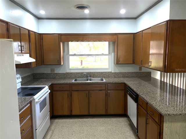 kitchen with ornamental molding, sink, and white appliances