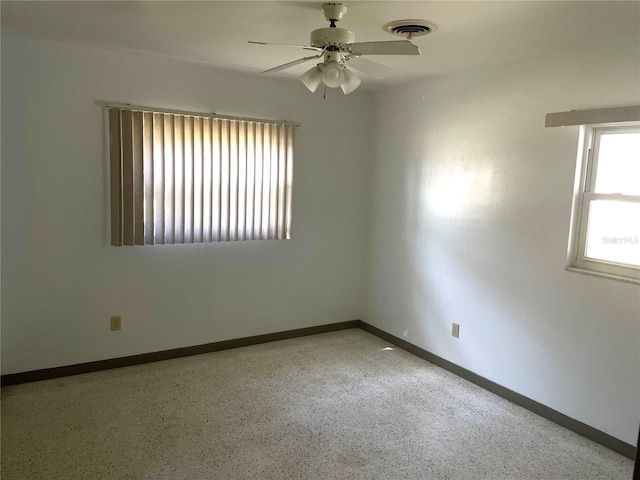 unfurnished room with ceiling fan