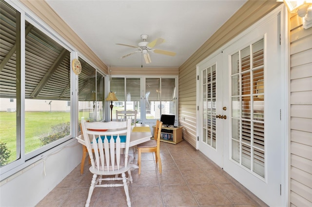 sunroom / solarium featuring ceiling fan