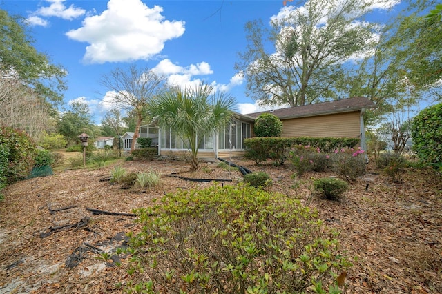 exterior space featuring a sunroom