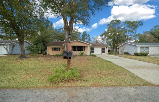 single story home featuring a front lawn, a garage, and a porch