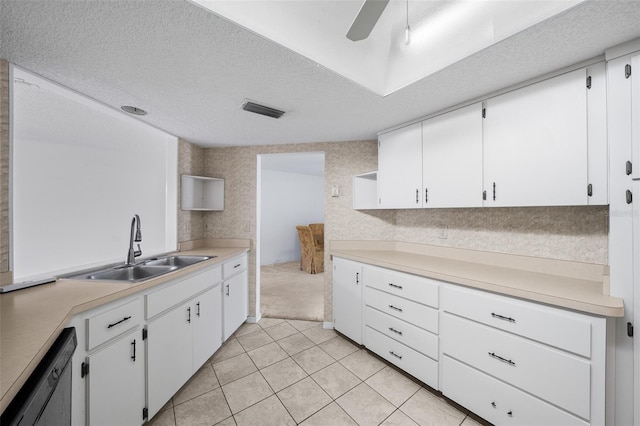 kitchen with ceiling fan, dishwasher, white cabinets, and sink