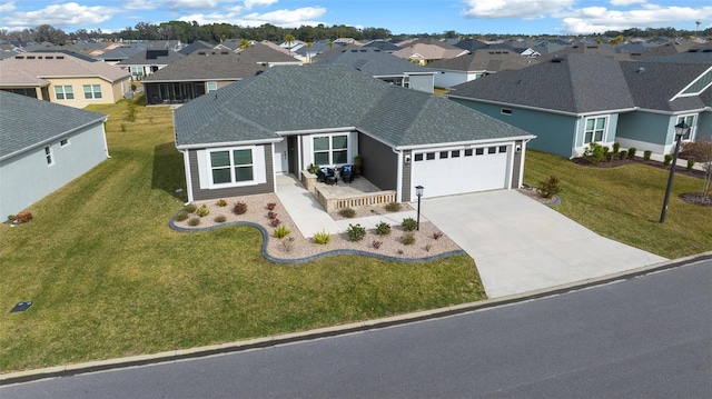 view of front facade featuring a garage and a front yard