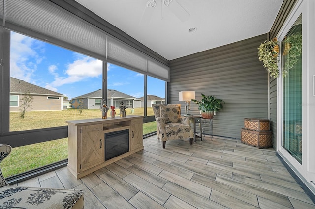 sunroom / solarium with ceiling fan