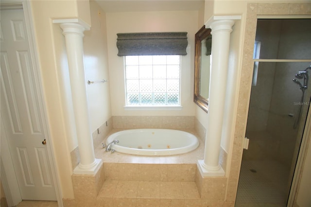 bathroom with ornate columns and independent shower and bath