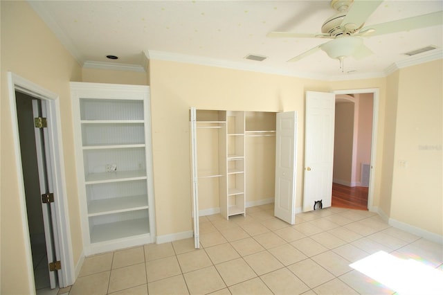 unfurnished bedroom featuring crown molding, ceiling fan, and light tile patterned flooring