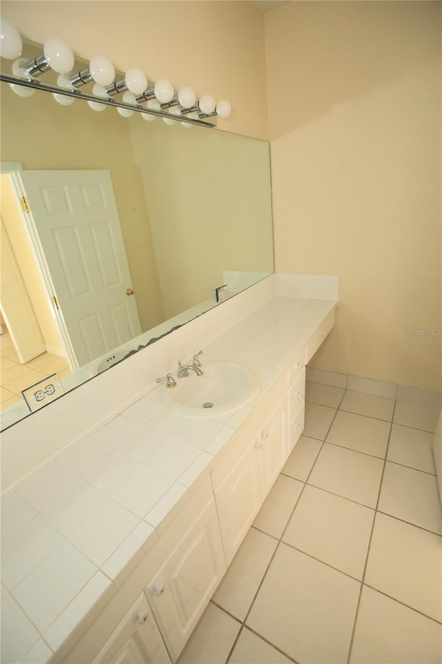 bathroom with vanity and tile patterned flooring