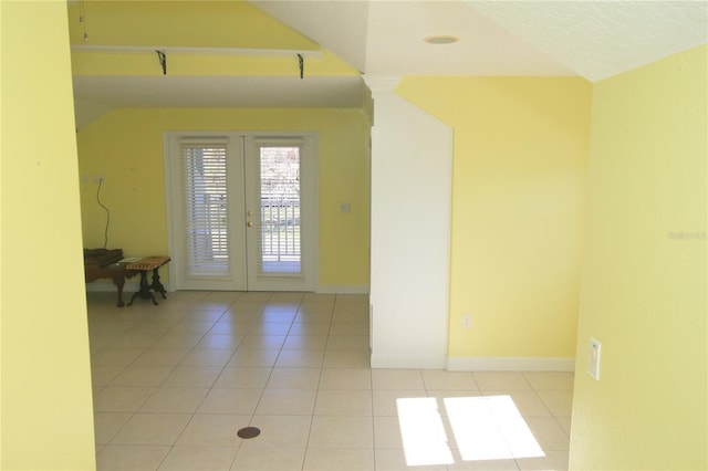 interior space featuring light tile patterned floors and french doors