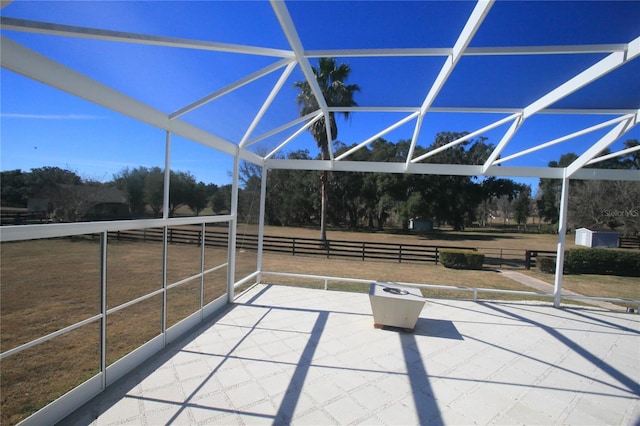 view of patio / terrace with a lanai