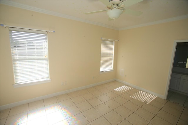 tiled spare room with ceiling fan and ornamental molding