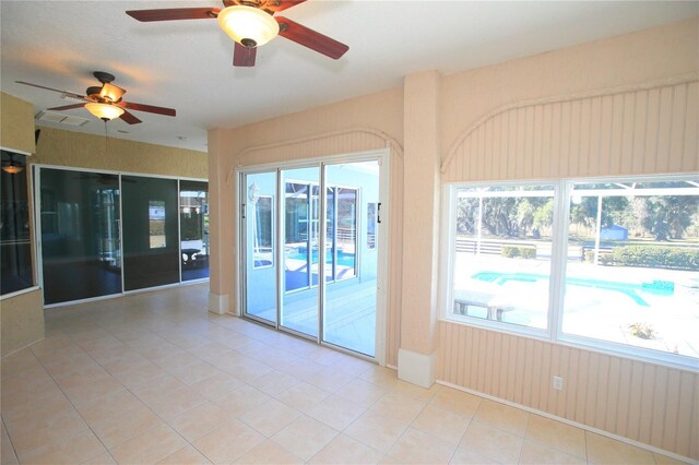 unfurnished room featuring light tile patterned floors