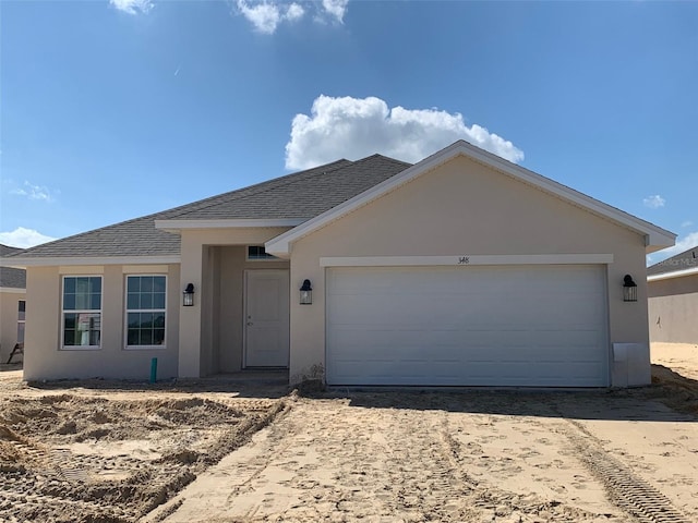 single story home featuring a garage