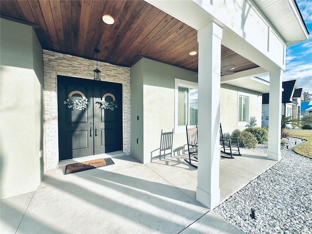 doorway to property with a porch