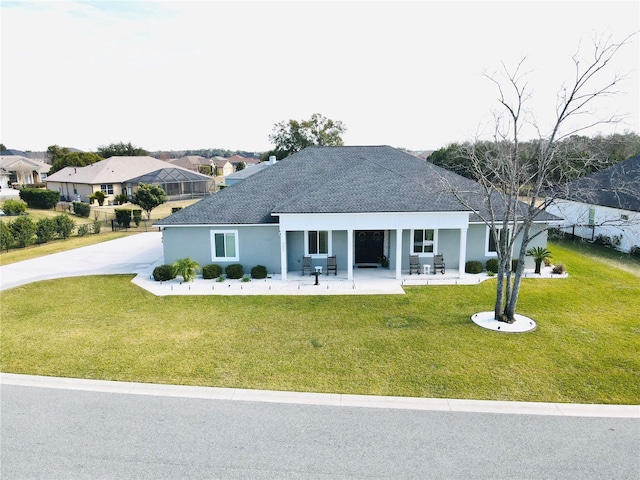 single story home with a front yard and a porch