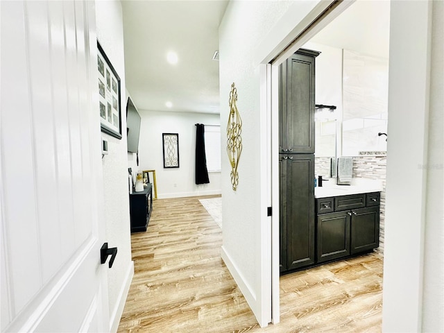 corridor featuring light hardwood / wood-style floors