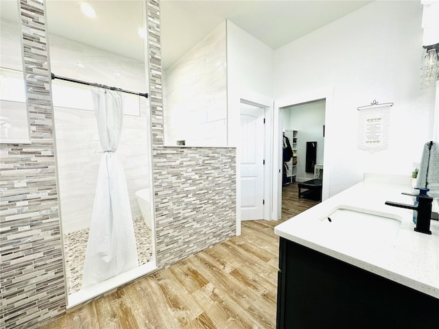 bathroom with hardwood / wood-style floors, vanity, and a shower with shower curtain