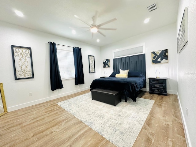 bedroom featuring ceiling fan and light hardwood / wood-style floors